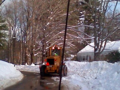 Heavy-Front-Loader-plowing-in-front-of-Earl-Johnson&rsquo;s-house-on-Hisgen-Road.