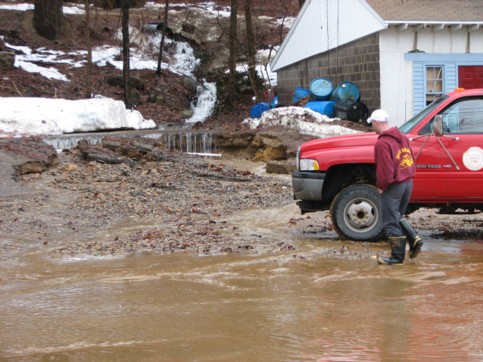 Water washed out the parking lot on the south side of PJ&rsquo;s